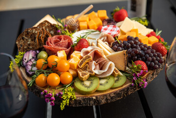 charcuterie, meats, meat, cheese, cheeses, cheeseboard, charcuterie board, fruit, nuts, vegetables, salami, kiwi, grapes, crackers, appetizer, snack, gourmet, chef, food, lunch