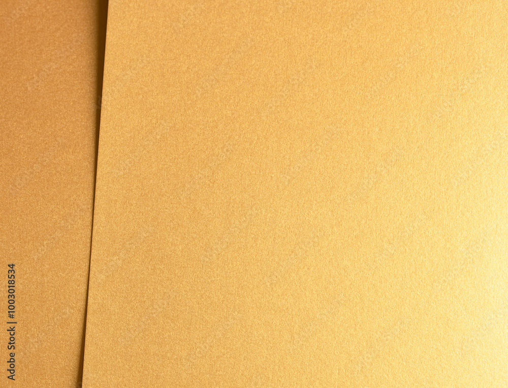 Poster Golden metallic paper with a rich, glossy texture and shiny surface. The elegant, layered design features subtle folds and bright reflections, creating a luxurious and classy
