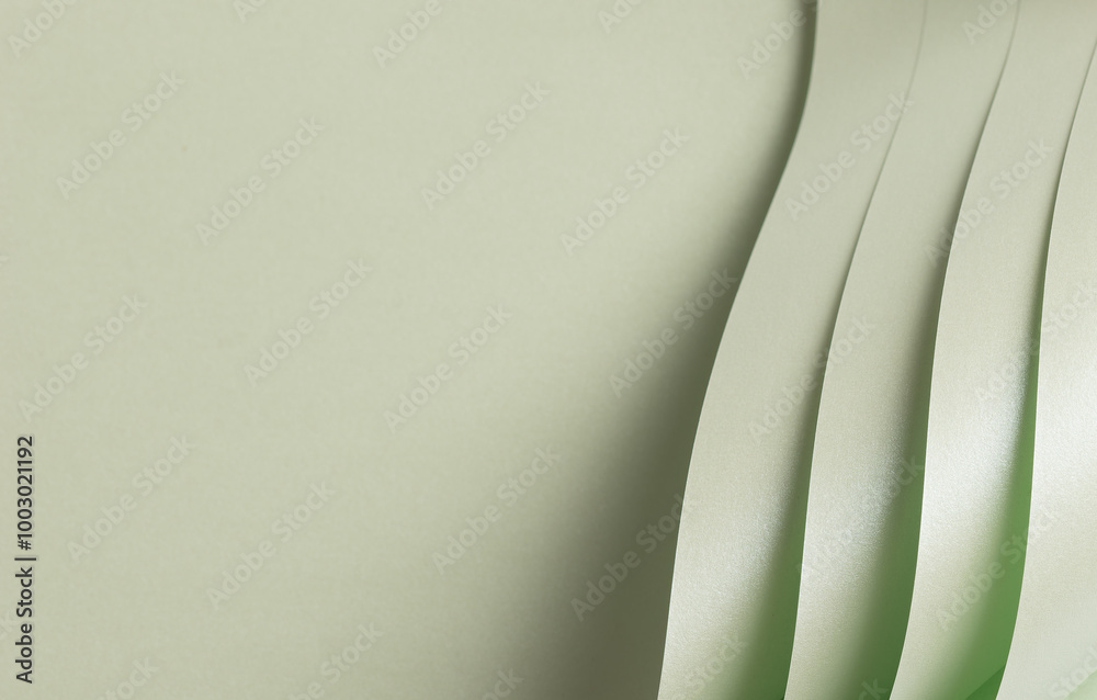 Aufkleber Paper with a soft texture in pale green and frosted mint tones. The minimalist, monochrome surface features elegant folds and layered geometric lines, creating a subtle metallic