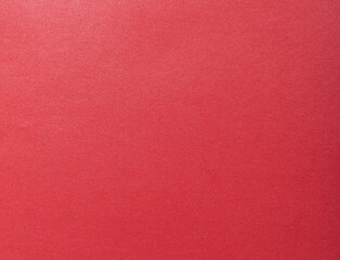 Red scarlet paper with a saturated tone, radiating passion and beauty. The minimalist, monochrome surface offers a clean, premium backdrop with rich, warm hues. This stylish and