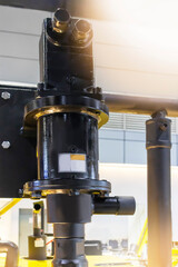 The machined steel structure has a round shape used in industrial work. The steel is attached to a steel nut.