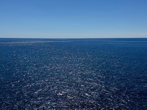 Ocean blue shiny water and clear sky