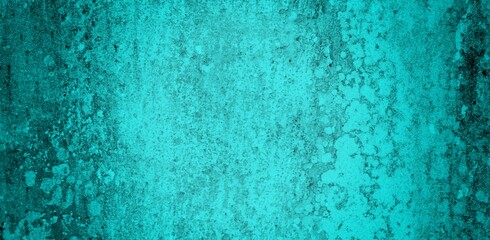 The background of the long wall is green with a combination of blue, Close-up of the facade of a building. Sunlight. Natural colors.