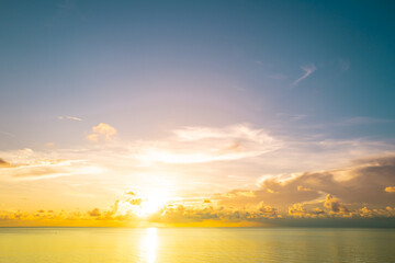 Sea sky concept, sunset colors clouds. Sunset sea landscape. Colorful beach sunrise with calm waves. Nature sea sky. Sunrise with clouds of different colors against the blue sky and sea.