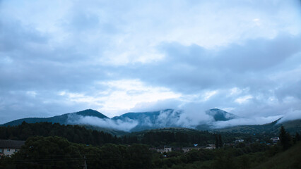 Mountain landscape with clouds and fog