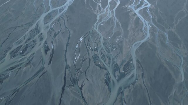 Aerial view of intricate river networks in highland terrain