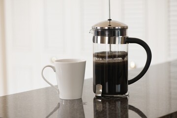 French press coffee maker.