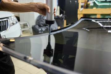 Installing windshield on a car with automotive design