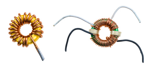 Closeup of toroidal inductor and transformer isolated on a white background. Two different coils -...