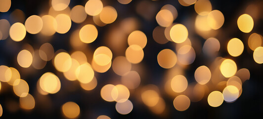 Obraz premium Abstract blurred background of yellow lights on a dark black defocused background