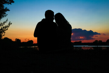 happy couple silhouette against a sunset romance