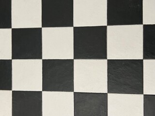 Black and white square tiles. Tiles on the floor