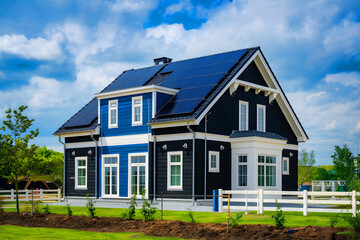 stunning new house with solar panels covering the roof.