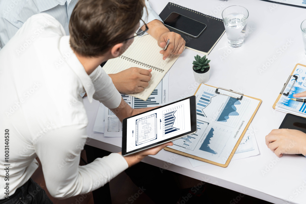 Fototapete analyst team uses bi fintech display tablet to analyze financial data . business people analyze bi s