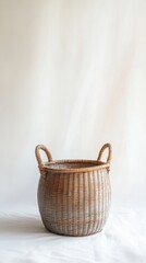 Woven wicker basket on white background