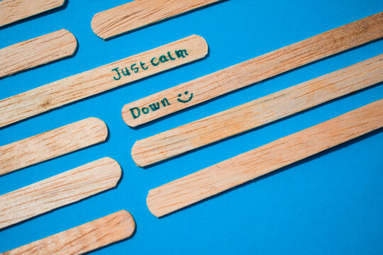 stick of ice cream with the words Just calm down. Motivational quotes, optimism, positive words. Isolated on background - Powered by Adobe