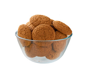 oatmeal cookies in a clear glass bowl isolated on white background, full depth of field.
