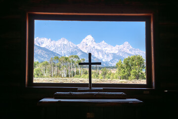 Grand Tetons with a wooden cross from the Chapel of the Transfiguration in Grand Teton National...
