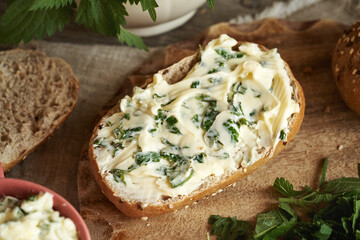 Nettle butter - homemade bread spread made on a slice of bread