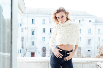 Beautiful fashion blonde woman posing in photo studio