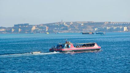 People travel on pleasure boat in Red Sea. Marine voyage on Red sea in Egypt