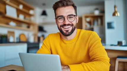 A man in a yellow sweater smiling at the camera while using his laptop, AI