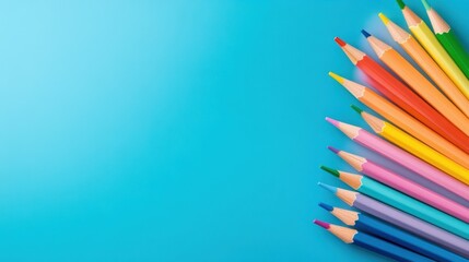 Fototapeta premium A row of colored pencils on a blue background, AI