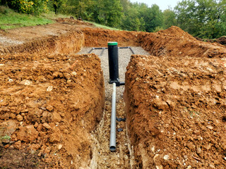 Water evacuation pipe being installed in a Sand and Gravel Filter Bed.