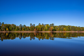 Colorful trees on Lake Nokomis, Tomahawk Wisconsin at the end of Septmber