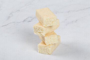 Cottage cheese coconut dessert in white chocolate glaze. Close-up