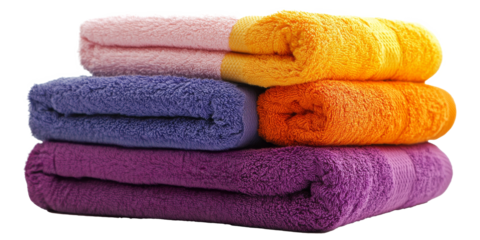 Stack of freshly rolled towels in vibrant colors displayed on a clean white background