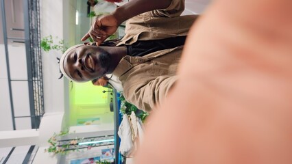 Content creator doing POV vlog in clothing store during promotional season, showcasing cheap...