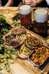 Traditional German sausages with beers, ideal for Oktoberfest, German cuisine, and pub menu themes