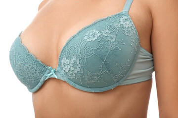 Young woman in blue bra on white background, closeup