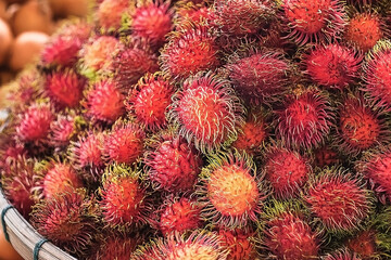 Fototapeta premium Lots of rambutan tasty and juicy. Background of rambutan
