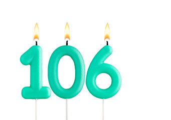 Green birthday candle on white background - Candle number 106