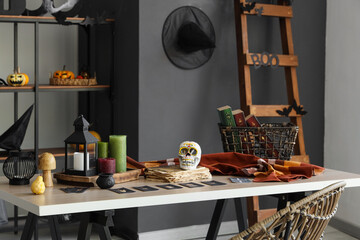 Stylish office with workplace decorated for Halloween celebration