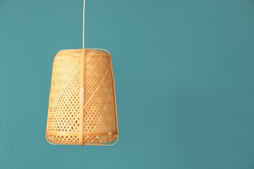 Rattan pendant lamp on blue background