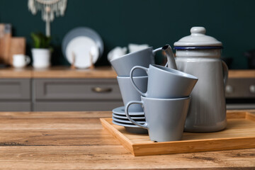 Grey dishes on table in kitchen, closeup
