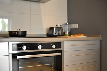 Modern kitchen interior with sleek electric oven. Domestic appliances and furniture in flat design style. Kitchen utensils and equipment for cooking and baking. Home cooking and meal preparation.