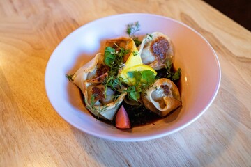 delicious and colorful looking dumplings filled with chicken at fine dining asian fusion restaurant in south america