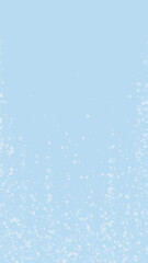 Magic falling snow christmas background. Subtle flying snow flakes and stars on light blue winter backdrop. Magic falling snow holiday scenery.   Vertical vector illustration.