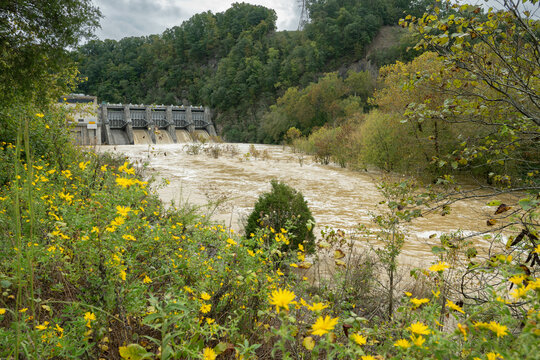 Fort Patrick Henry Dam, spilling, muddy flood waters from four spillways. Located in Sullivan County in Kingsport, Tennessee on the South Fork Holston River.