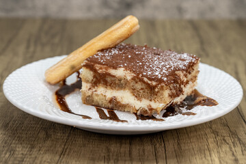 No Italian meal is complete without tasting the tiramisu layered cake with chocolate garnishment