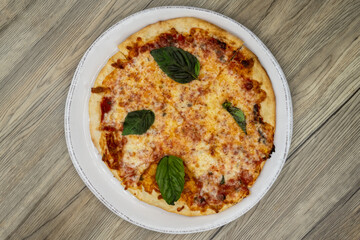 Overhead view of Margherita pizza cooked to perfection with extra crispy crust