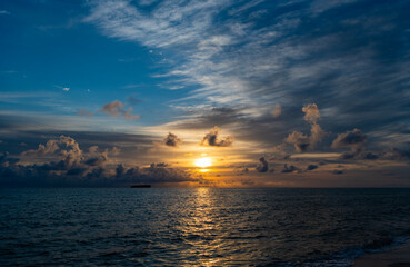 Fototapeta premium Romantic summer vacation at seascape. Dramatic sunrise. Sea sunrise on summer beach. Sunset seascape at summer vacation. Sunrise with sea beach. Dramatic horizon sea view on sunset. Peaceful sunset