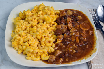  macaroni and cheese  with a side of beef stew