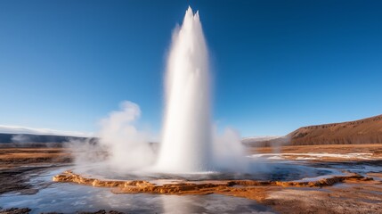 Erupting Geyser in Iceland with Clear Blue Sky