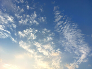 gentle white clouds in the blue sky