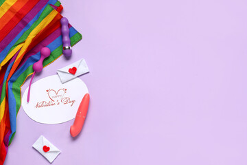 Sex toys with rainbow LGBT flag, festive postcard and decor on lilac background. Valentine's Day celebration